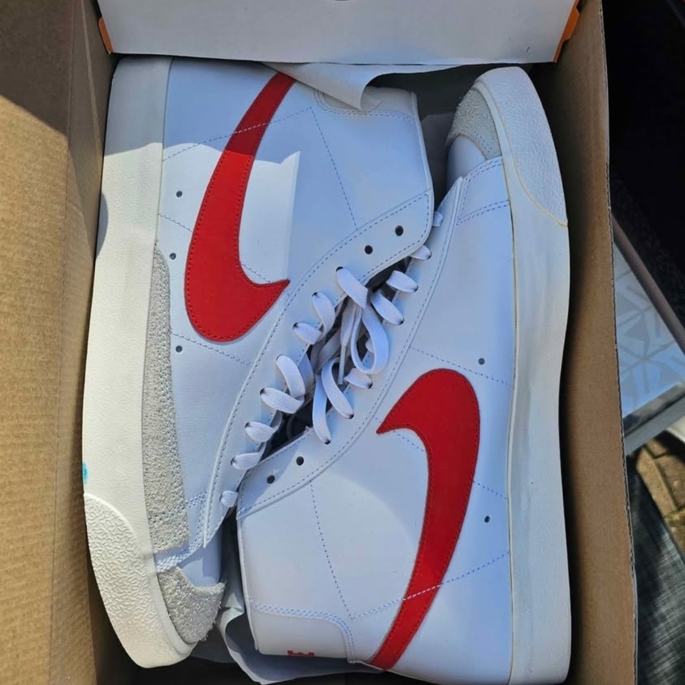 Nike White High-Top Sneakers with Red Swoosh